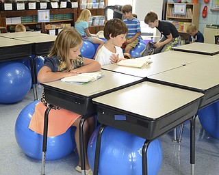 Katie Rickman | The Vindicator.Alena Len, 8, of North Jackson and Benjamin Moore, 8, also of North Jackson read in Mrs. Cara Vernal's third grade classroom at Jackson-Milton Elementary School Tuesday, September 9, 2014 in North Jackson, Ohio.