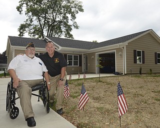 Katie Rickman | The Vindicator.Ron Borngesser, left, poses for a photo with James Skok, a retired veteran who will be moving into this Habitat for Humanity house Wednesday, Sept. 10, 2014.