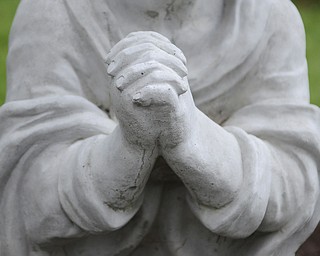Katie Rickman | The Vindicator.Praying hands of an angel in the Angel Garden at Unity Centre for Spiritual living in Liberty Tuesday, Sept. 9, 2014. The partitioners of the centre will gather in the garden Wednesday for a candle-lit service as a part of a world-wide prayer vigil.