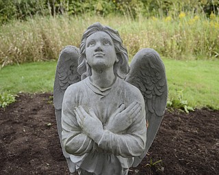 Katie Rickman | The Vindicator.A statue of an angel in the Angel Garden at Unity Centre for Spiritual living in Liberty Tuesday, Sept. 9, 2014. The partitioners of the centre will gather in the garden Wednesday for a candle-lit service as a part of a world-wide prayer vigil.