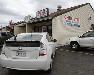        ROBERT K. YOSAY  | THE VINDICATOR..China StarÕs business on Canfield Rd in Youngstown is suffering from the recent coverage of a chinese food truck that had spoiled food. .owned and operated by Guosheng Dong and Chen Jiang..  -30-