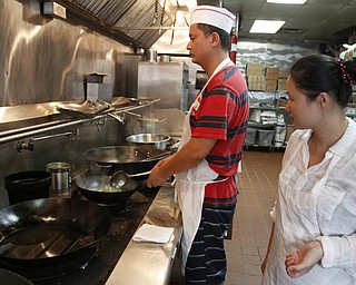        ROBERT K. YOSAY  | THE VINDICATOR..China StarÕs business on Canfield Rd in Youngstown is suffering from the recent coverage of a chinese food truck that had spoiled food. .owned and operated by Guosheng Dong and Chen Jiang..  -30-