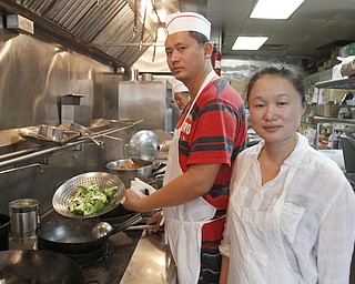        ROBERT K. YOSAY  | THE VINDICATOR..China StarÕs business on Canfield Rd in Youngstown is suffering from the recent coverage of a chinese food truck that had spoiled food. .owned and operated by Guosheng Dong and Chen Jiang..  -30-