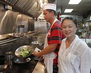        ROBERT K. YOSAY  | THE VINDICATOR..China StarÕs business on Canfield Rd in Youngstown is suffering from the recent coverage of a chinese food truck that had spoiled food. .owned and operated by Guosheng Dong and Chen Jiang..  -30-