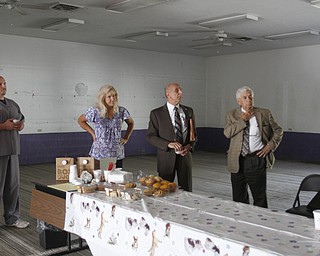        ROBERT K. YOSAY  | THE VINDICATOR..Rick Tunison with the dog pound  Tracie Kaglic  architect with  Olsavsky Jamine Architects,Inc  Jim Fortunato and Ray Jaminet - architect talk about the coversion of the building to a dog pound.  -30-