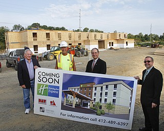        ROBERT K. YOSAY  | THE VINDICATOR..Larry Kosiba with  Salem Sustainable Opportunity Developement Center   Rich Augustine with DAV construction Mayor  John Berlin and  Michael Mancuso also with  Salem Sustainable Opportunity Developement Center   .. -The city of Salem received more than $1.85 million from leasing rights on city property, said Mayor John Berlin. Salem used $650,000 to pay down debt from the cities efforts to revitalize the downtown and improve roads for economic development..The hotel will be the only one in Salem and represents just a part of the economic development in the city....  -30-       ROBERT K. YOSAY  | THE VINDICATOR...  -30-