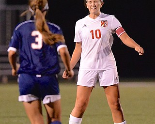 Jeff Lange | The Vindicator  Canfield's Sydney Miller heads the ball down the field during the Cardinals' soccer game against Austintown Fitch, Monday evening.