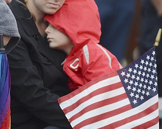 Katie Rickman | The Vindicator.Michelle Marcum of Austintown holds her 5-year-old son Alec during the memorial service in Austintown remembering those who lost their lives 13 years ago Sept. 11, 2001.
