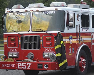 Katie Rickman | The Vindicator.A New York City engine no. 257 was one of the fire engines that responded during the attacks on the world trade center 13 years ago, during the ceremony at the memorial park in Austintown many stood near the engine, Sept 11, 2014.