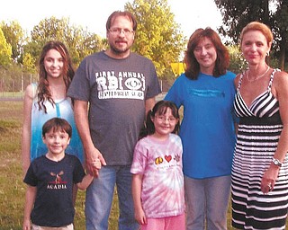 SPECIAL TO THE VINDICATOR
From left to right are the Hoffmans, Sarah, Sean, Mike, Olivia and Kim, and Carmella Abraham, president of the Canfield Lions Club. 