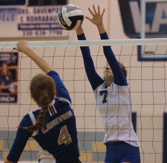 Hubbard's Macey Sarisky (7) blocks a spike attempt by Lakeview's Whitney Winch (4) spike during Thursday evenings matchup at Lakeview High School in Cortland.  Dustin Livesay  |  The Vindicator 09/11/14  Lakeview High School.