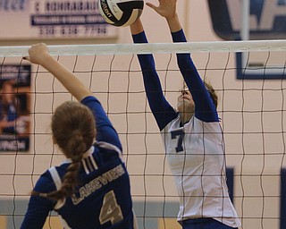 Hubbard's Macey Sarisky (7) blocks a spike attempt by Lakeview's Whitney Winch (4) spike during Thursday evenings matchup at Lakeview High School in Cortland.  Dustin Livesay  |  The Vindicator 09/11/14  Lakeview High School.