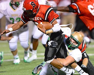 Jeff Lange | The Vindicator  Ursuline's Tyler Leonard sacks  Big Red's quarterback Mandela Lawrence-Burke in the second quarter of Friday night's contest in Seubenville.