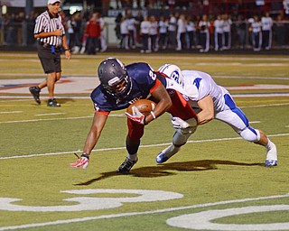 Katie Rickman | The Vindicator .Fitches Darrin Hall is tackled by Matt Monlar (2) on the 32 yard line during the 2nd quarter during the game against Brunswick at Fitch High School on Friday, Sept. 12, 2014.