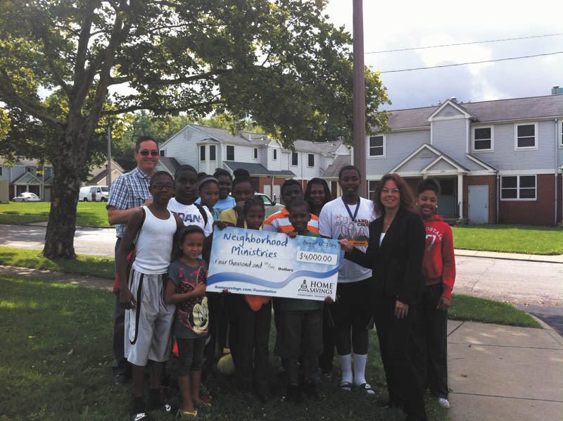 SPECIAL TO THE VINDICATOR
Home Savings Charitable Foundation has donated $4,000 to Neighborhood Ministries for the support of after-school and summer programming for children from low-income families. Above, kids at Neighborhood Ministries enjoyed a visit from home Savings. Standing in back on the left is Mark Samuel, executive director of Neighborhood ministries; in front on the right is Lorraine Federovitch, branch manager of Home Savings McCartney Road office.