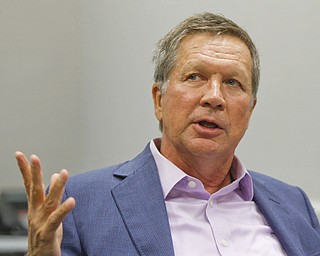Ohio Gov. John Kasich talks with members of The Vindicator’s editorial board Tuesday.