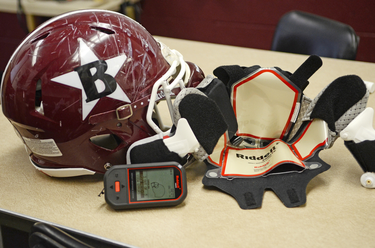 Katie Rickman | The Vindicator.Boardman High School football team has begun using Ridell Impact Response System technology that allows the coaching staff to monitor and prevent concussions Wednesday, Sept. 17, 2014. Seen here is a helmet which has the electronic lining inserted, to the right is one of the inserts.  Six helmets, an electrical pad is inserted which allows coaches to monitor the players impact.