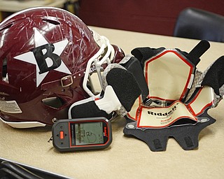 Katie Rickman | The Vindicator.Boardman High School football team has begun using Ridell Impact Response System technology that allows the coaching staff to monitor and prevent concussions Wednesday, Sept. 17, 2014. Seen here is a helmet which has the electronic lining inserted, to the right is one of the inserts.  Six helmets, an electrical pad is inserted which allows coaches to monitor the players impact.