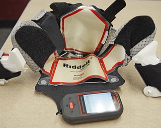Katie Rickman | The Vindicator.Boardman High School football team has begun using Ridell Impact Response System technology that allows the coaching staff to monitor and prevent concussions Wednesday, Sept. 17, 2014. Seen here is a device that coaches use to keep track of what the player is experiencing when coming in contact with other players. Inside 6 helmets, an electrical pad is inserted which allows coaches to monitor the players impact.