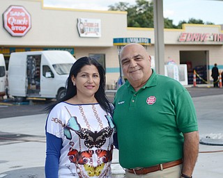 Katie Rickman | The Vindicator.Sami Rafidi stands with his wife Rita outside of their business Sami Quick Shop Wednesday, Sept. 17, 2014 in Struthers. The grand opening will be Saturday. The grand opening will be Saturday, Sept. 20, 2014.