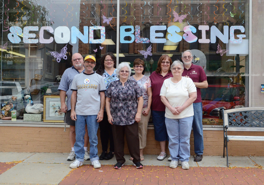 Katie Rickman | The Vindicator.Second blessing in Salem is run by mostly volunteers who put in plenty of hours at the store as well as in their homes by washing and sorting the items long after store hours, volunteers pose outside of the store on Wednesday, Sept. 9, 2014...Back row L-R.David Baker and his wife Chris (Chris is the store manager) of Salem, Deb Vahalik of Salem, Marilee Bodendorfer and her husband David of Salem..Front row L-R.Mar McMohon of Salem, Lynn Bennett of Greenford, Nancy Rock of Salem..also, not shown is volunteer Kathy Toucher of Wynona.