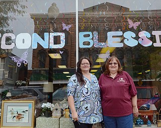 Katie Rickman | The Vindicator.Chris Baker (left), manager of Second Blessing stands with volunteer Marilee Bodendorfer outside of the store on Wednesday, Sept. 9, 2014 in Salem, Ohio. The store is run by mostly volunteers who put in hours even after the store has closed for the day. ..