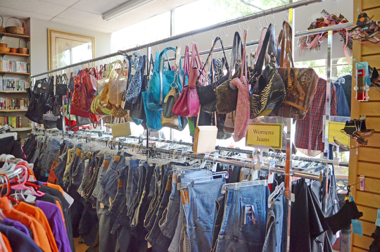 Katie Rickman | The Vindicator .Purses and clothing on display at Second Blessing consignment shop on Wednesday, Sept. 10, 2014 in Salem, Ohio.