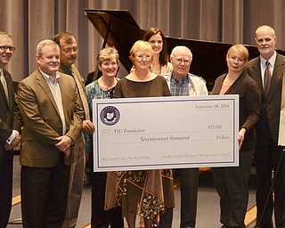 Katie Rickman | The Vindicator.L-R.Paul McFadden, President, YSU Foundation; Dr. Michael Crist, Director, Dana School of Music; James Cunningham; Donna Hurrelbrink Pate;, Janne Hurrelbrink Bias; Heather Chunn; Alexander Stewart; Wendy Mundell and Dr. Bryan DePoy, Dean, College of Creative Arts and Communication ..Check presentation for the Donal W. "Squire" Hurrelbrink Memorial Scholarship at Youngstown State University, Friday, Sept. 19, 2014.