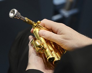 Katie Rickman | The Vindicator.A YSU instructor holds his trumpet during the scholarship announcement for the Donal W. "Squire" Hurrelbrink Memorial Scholarship at Bliss Hall Friday, Sept. 19, 2014.