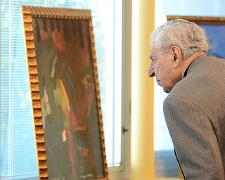 Katie Rickman | The Vindicator .Harry Meshel looks at the art work of local artist Al Bright at the Founder’s Day Program at Willliam Holmes McGuffey Elementary School on Friday, Sept. 19, 2014 in Youngstown.