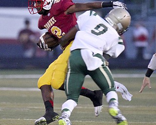 William D Lewis the Vidicator  Mooney's C.J. Amill(2) is stopped by SVSM's Tyrece Speaight(9) during 1rst half action in Austintown 9-19-14.