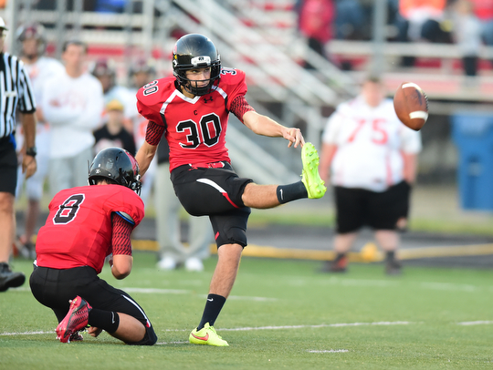 CANFIELD, OHIO - SEPTEMBER 19, 2014: Kicker Bryan Kristan #30 of Canfield kicks a field goal from the hold of Matt Milligan during the 1st half of Friday nights OHSAA football game at Canfield High School. (Photo by David Dermer/Youngstown Vindicator) This would make the score 3-0 Canfield.
