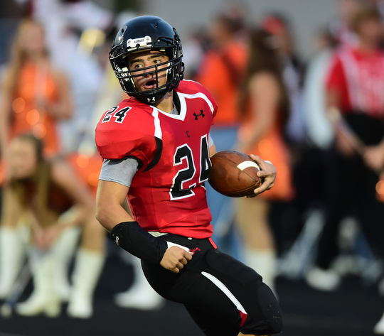 CANFIELD, OHIO - SEPTEMBER 19, 2014: Running back Luke Whittenberger #24 of Canfield celebrates after scoring a touchdown during the 1st half of Friday nights OHSAA football game at Canfield High School. (Photo by David Dermer/Youngstown Vindicator)