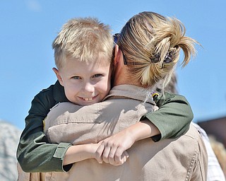 Jeff Lange | The Vindicator  Ethan Baker of Newark hugs his mom Shannon Baker after she returned home from her 120 day deployment to Southwest Asia, Friday afternoon at the Youngstown Air Reserve Station.