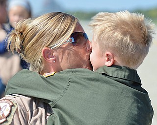 Jeff Lange | The Vindicator  Shannon Baker (left) of Newark give her son Ethan a kiss, Friday afternoon at the Youngstown Air Reserve Station in Vienna. Baker last saw her son in May due to a deployment to Southwest Asia for 120 days.