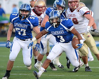 Jeff Lange | The Vindicator  Poland's senior running back Marlon Ramirez (3) rushes for a small gain early in the first quarter against Watterson, Friday night in Poland.