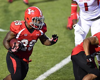 YOUNGSTOWN, OHIO - SEPTEMBER 20, 2014: Running back Martin Ruiz #29 of YSU runs the football behind a blocker during the 1st half of Saturday nights game NCAA football at Stambaugh Stadium. (Photo by David Dermer/Youngstown Vindicator) He would score a touchdown on this play.