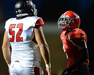YOUNGSTOWN, OHIO - SEPTEMBER 20, 2014: Defensive back Julis Childs #1 of YSU confronts offensive linemen Colin Gdula #52 of Saint Francis after a play during the 1st half of Saturday nights game NCAA football at Stambaugh Stadium. (Photo by David Dermer/Youngstown Vindicator)