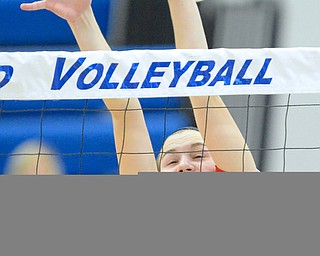 Jeff Lange | The Vindicator  Emily Holroyd of Perry lets a ball slip past her fingers as she attempts to block a South shot during the Pirates' match against South at Hubbard High School, Saturday morning.