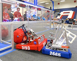Jeff Lange | The Vindicator  Fitch's (red shirts) Westly Pringle (left) and hunter Hykes (right) look in shock as their robot is rammed by an opposing robot from behind, Saturday afternoon at Fitch High School.
