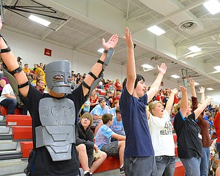 Jeff Lange | The Vindicator  Champion junior David Hatt (robot) leads (from left) Maurice Georgia of Harding, Natalie Hall of Harding, Jen Nold of Mentor, Samantha Nold of Warren along with other crowd members during a time out at the Mahoning Valley Robotics Challenge held in Fitch's gymnasium, Saturday, September 20th.