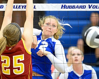 Jeff Lange | The Vindicator  Hubbard's Caitlin O'Hara watches her shot go down into Cardinal territory past the block of Mooney's Nichole Webber, Saturday at Hubbard High School.