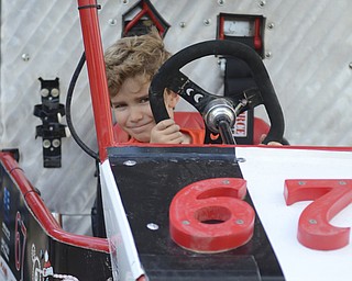 Katie Rickman | The Vindicator.Vaughn Hinrichs, 5, of Boardman pretends to race in a small race car at Silly Science Sunday at Oh Wow in Sunday, Sept. 21, 2014 in Youngstown, Ohio.