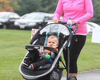 Parker Birch (1) of Boardman rides in a stroller while being pushed by his mother Alyssa Birch of Boardman during the Super Walk for Multiple Sclerosis at the Wick Recreation Area of Mill Creek Park on Sunday morning.  Dustin Livesay  |  The Vindicator  09/21/14  Mill Creek Park.