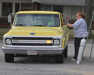 Lizz Collingwood of Struthers gives out registration forms to classic cars and trucks that took part the Cops Car Show in the Struthers Plaza in Struthers on Sunday afternoon.  Dustin Livesay  |  The Vindicator  09/21/14  Struthers Plaza.