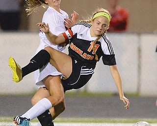 Howland’s Lydia Weisman and Boardman’s Alison Green get tangled up as they fight for possession of the ball during their girls soccer game Wednesday in Boardman. The Tigers edged the Spartans, 3-2.