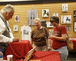 MADELYN P. HASTINGS | THE VINDICATOR..Jim Traficant visits Barnes & Noble in Boardman, Ohio, for the signing of his book 'America's Last Minute Man.' Harriett and Dian Toth of Hermitage, Pa., laugh while Traficant cracks a joke. 