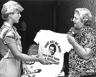 August 3, 1982 - Janis Pearch hands her mother, Ruth Pearch, $6 to buy a "Traficant Support" shirt.