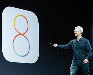 Apple CEO Tim Cook speaks about iOS 8 at the Apple Worldwide Developers Conference in San Francisco. Apple released a new update, dubbed iOS 8.0.2, which it said would fix the problems caused by the iOS 8.0.1 update that it released Wednesday.