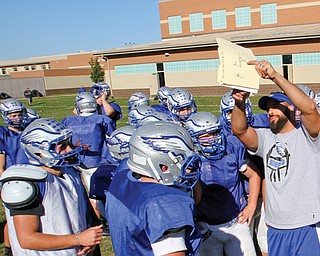 Hubbard assistant coach Jason McElhaney works with Hubbard’s offense.